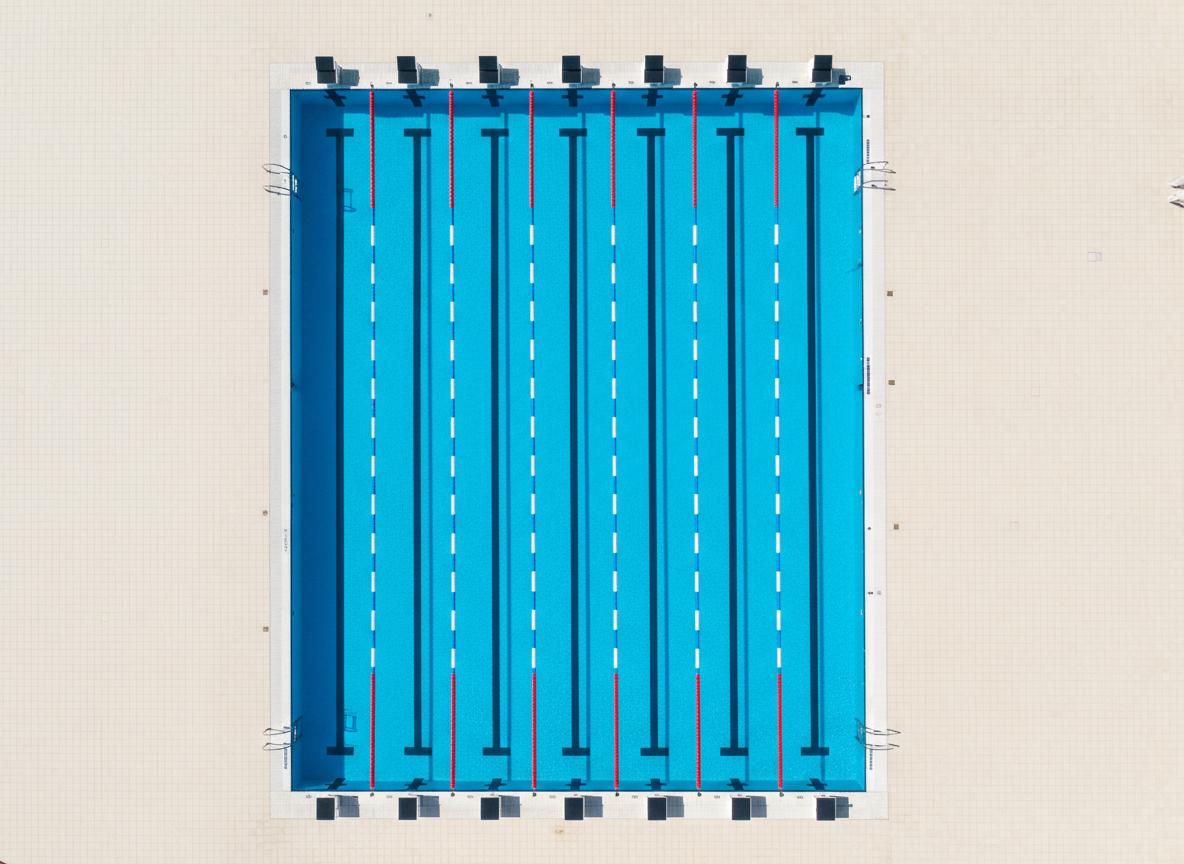 Aerial view of 25m competition swimming pool with filtration system and tile finishing